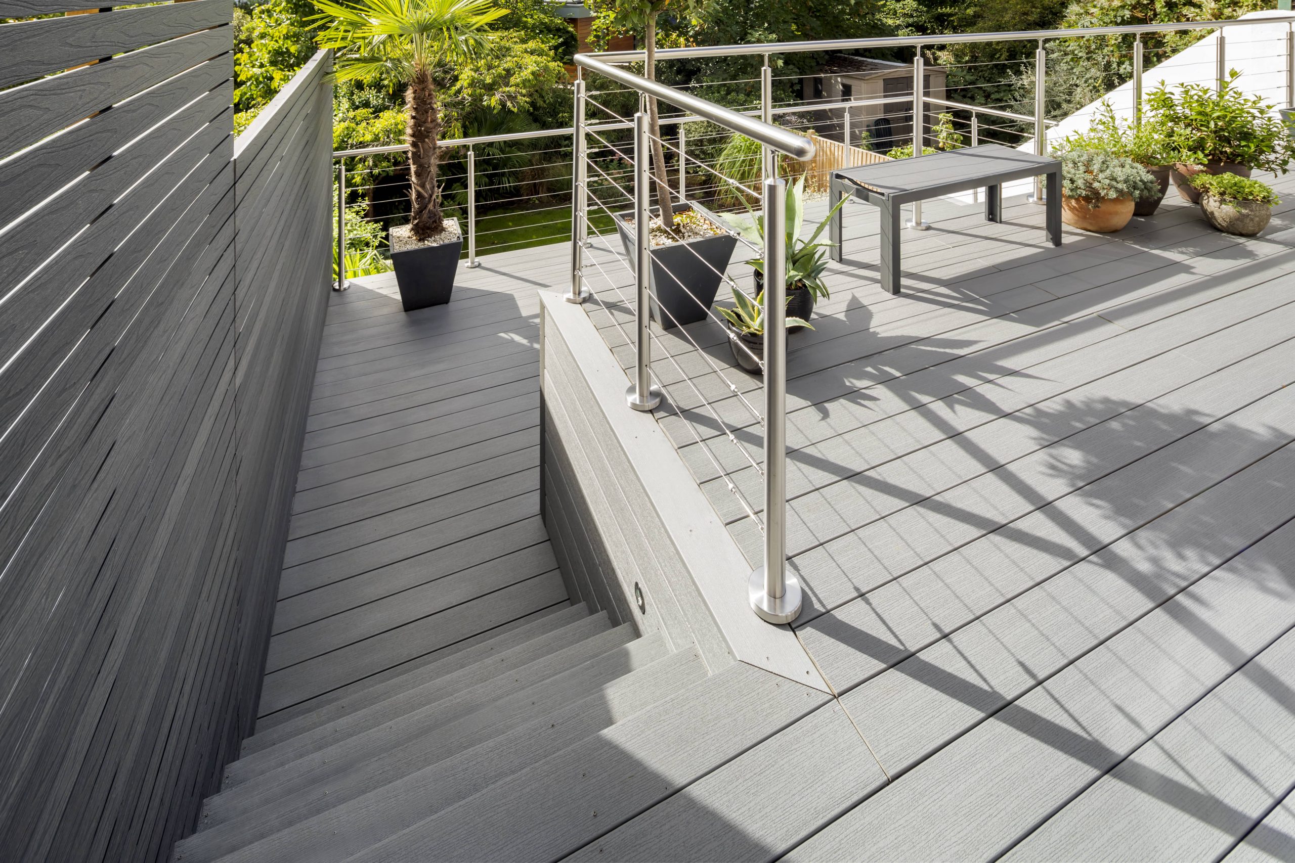 grey composite millboard decking staircase with grey composite screens and steel balustrade