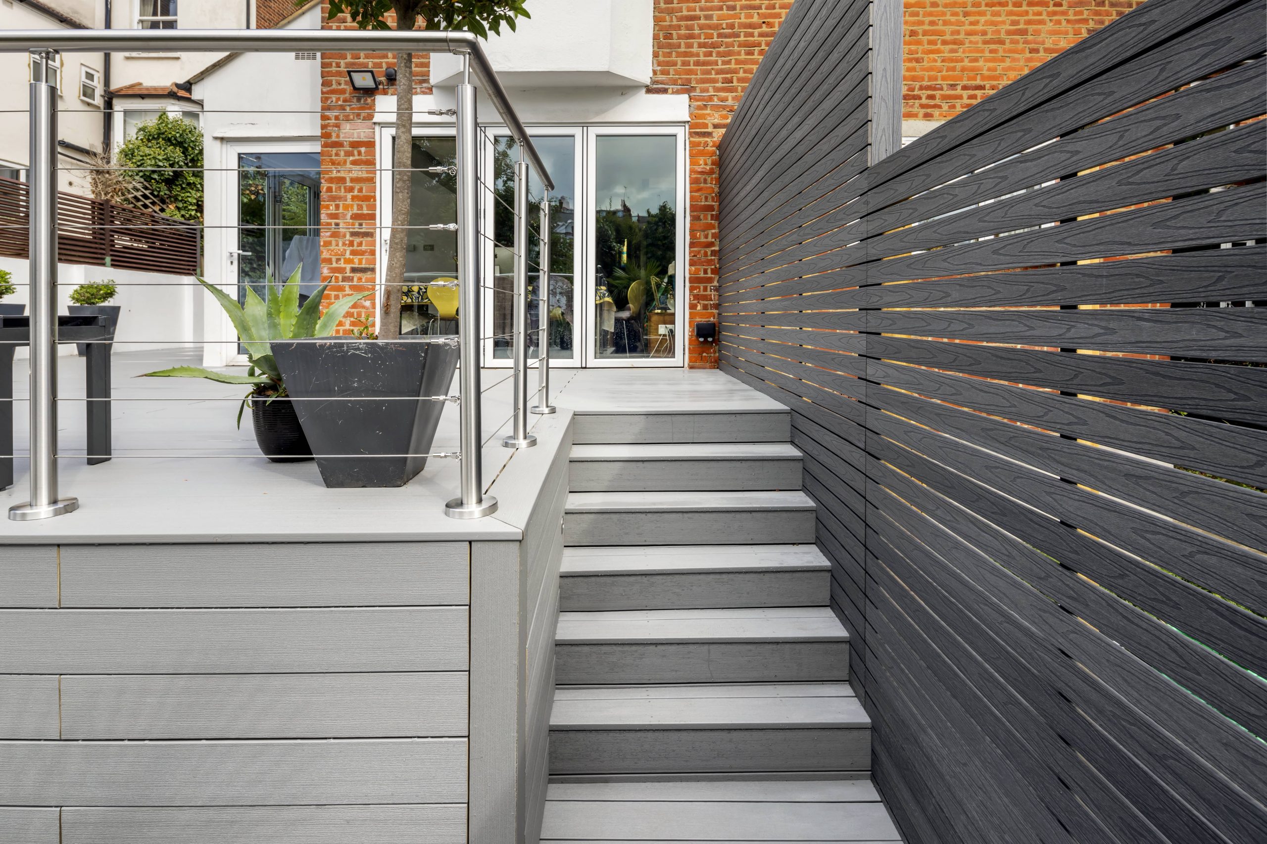 grey composite millboard decking staircase with grey composite screens